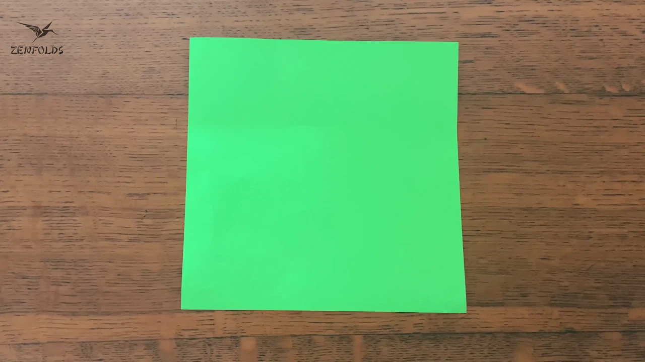 a square sheet of green origami paper