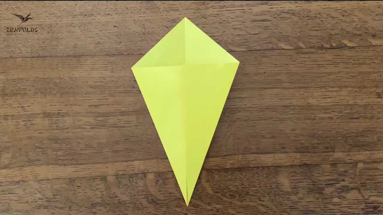 a yellow origami kite base