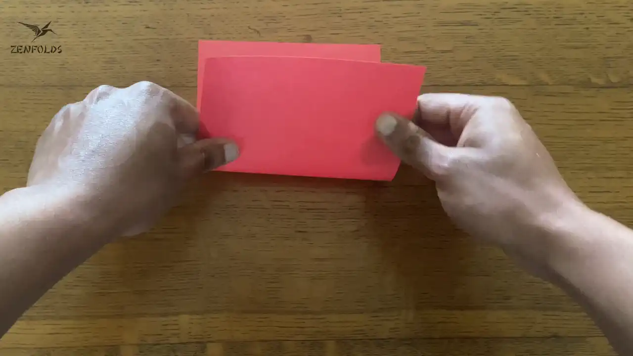 rectangle origami sheet folded in half vertically