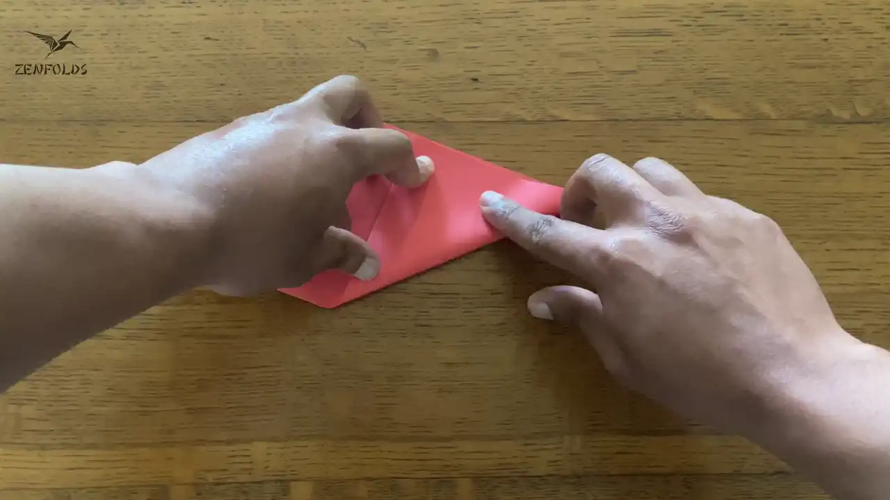 origami sheet folded in half diagonally from the right