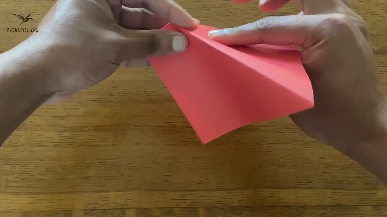 a valley spine being turned into a mountain fold to make an origami inside reverse fold