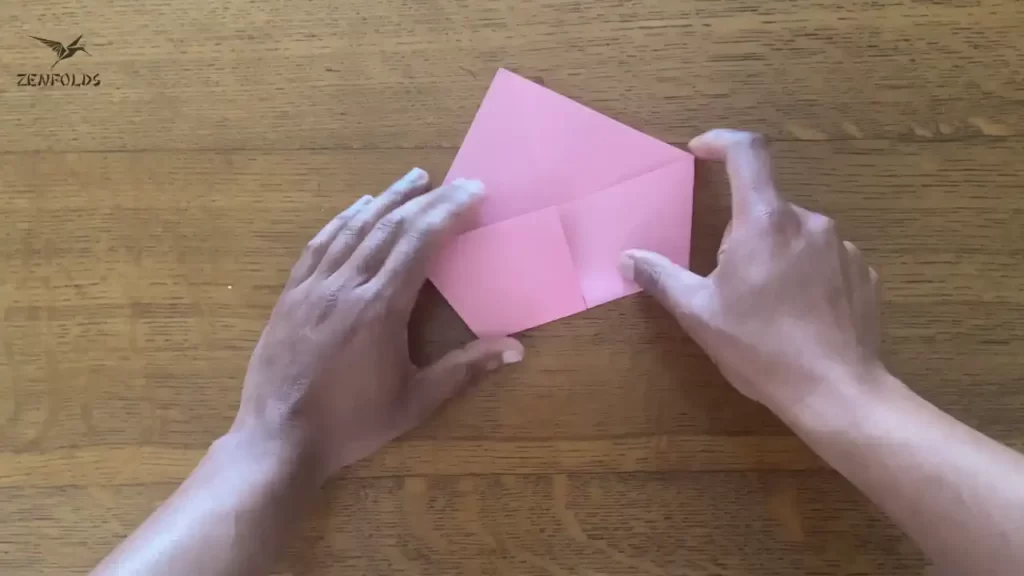 reverse of pink kite base folded in half