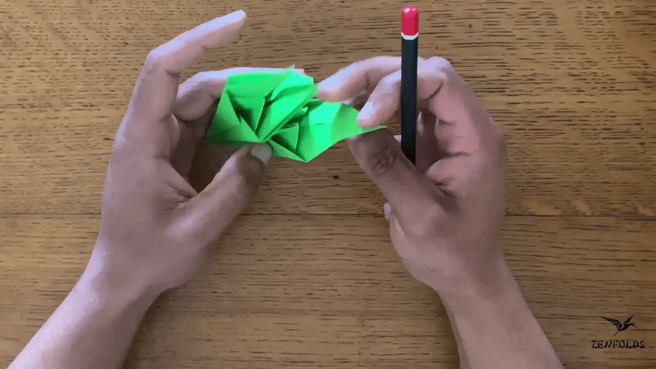 origami lily leaves curled by pencil